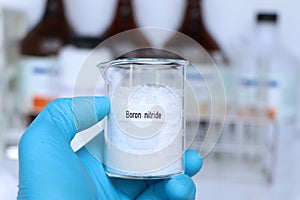 Boron nitride in container, chemical analysis in laboratory