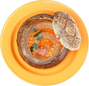 Borsch soup is poured in a dish as bread
