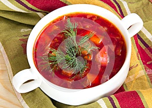 Borsch in white bowl . Red beetroot traditional soup.