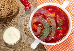 Borsch in white bowl . Red beetroot traditional soup.