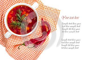 Borsch in white plate isolated on white. Red traditional beetroot soup