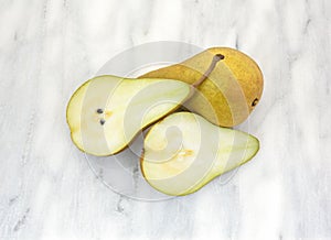 Bosc pears on marble cutting board