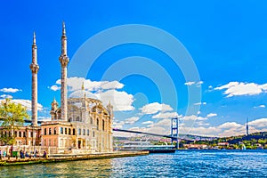 The Bosphorus Bridge and the Ortakoy Mosque during summer sunny day in Istanbul, Turkey