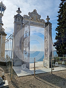 Bosphorus gate at Dolmabahce palace in Istanbul, Turkey. Twilight, clouds, entry, baroque gateway.