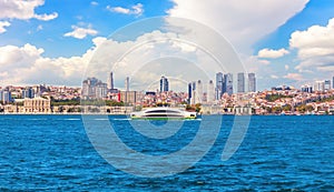 The Bosphorus straight view, the Dolmabahce palace and Besiktas skyscrappers in the background, Istanbuil, Turkey photo