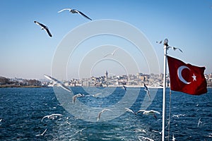 Bosphorus straits ferry view with Turkish flag, Istanbul, Turkey