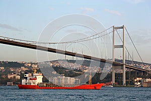 Bosporus Bridge with freighter photo