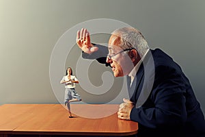 Boss is angry at the calm businesswoman