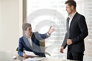 Boss criticizing and firing employee for bad work