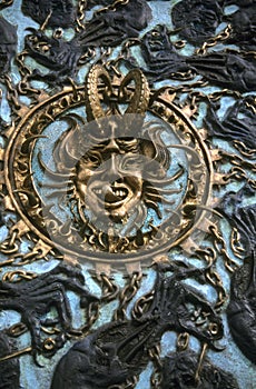 Boss detail, jester with leering tongue