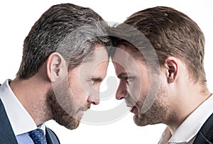 boss and employee. businessmen face to face. disagreed men partners. business competition