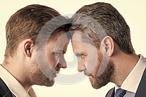 boss and employee. businessmen face to face. disagreed men partners. business competition