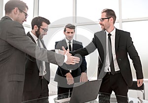 Boss and employee shaking hands with each other