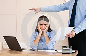 Boss Firing Woman Worker Sitting In Modern Office, Cropped