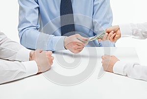 Boss giving dollars to collaborator