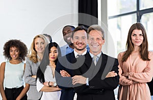 Boss With Group Of Businesspeople In Creative Office, Mature Successful Businessman Leading Business People Team Stand