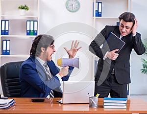 Boss and his male assistant working in the office