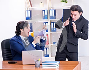 Boss and his male assistant working in the office