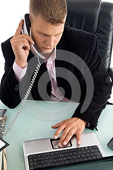 Boss holding the phone receiver and working