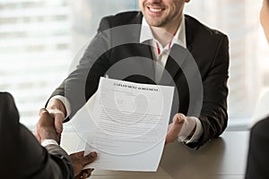 Recruiter giving employment agreement to applicant photo