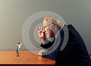 Boss looking at small aggressive woman