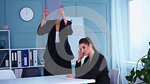 Boss screaming at frustrated employee, bullying and emotional abuse at work. Toxic work environment. Angry female irate