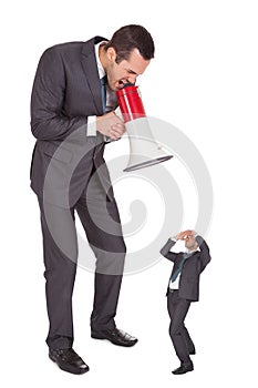 Boss screaming in megaphone at employee