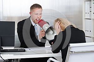 Boss Shouting At Businesswoman Through Loudspeaker In Office