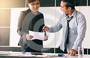 Boss shouting to employee while mistake working.