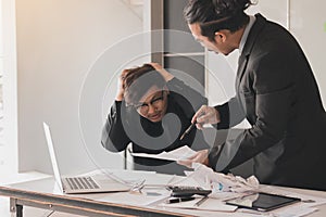 Boss shouting to employee while mistake working
