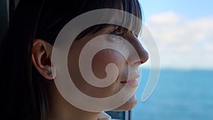 Boss woman dreaming ocean view window closeup. Business trip vacations concept