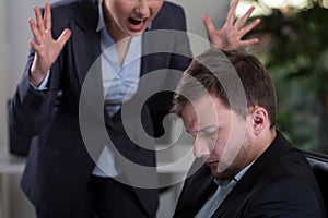 Boss yelling at employee photo