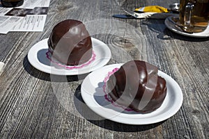 Bossche Bol, typical Dutch pastry with chocolate and cream from the city of Den Bosch