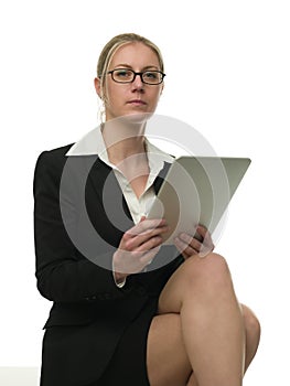 Bossy woman checking reports on a tablet comput