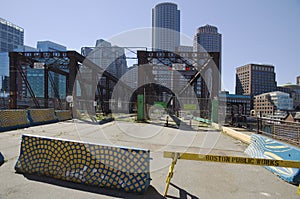 Boston bridge under construction and skyscrapers.