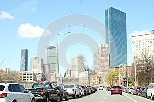 Boston heavy traffic, with City skyline buildings in the blue sky, THE PRUDENTIAL CENTER