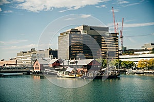 Boston cityscape in sunny day, view from harbor on downtown, Massachusetts, USA