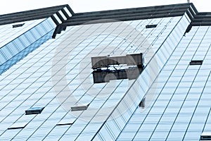 Boston Skyline syscraper group workers cleaning windows service on high rise building blue window