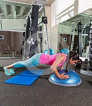 Bosu push up push-up woman at gym workout