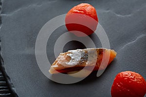 Bota sardine with osmotized tomatoes macro photo