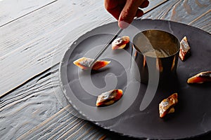 Bota sardine preparation with chef hand photo