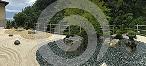 botanical garden with japanese stones near varone waterfalls in italy