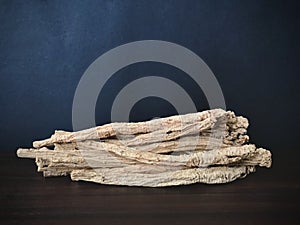 Codonopsis Root on brown wooden table with black background. photo