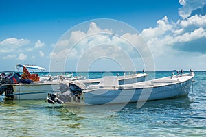 Botes anchored on the beach at Los Roques National Park photo