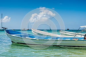 Botes anchored on the beach at Los Roques National Park photo