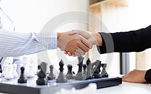 Both businessmen played chess to increase their business skills and held hands together for success