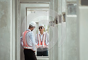 Both of construction engineers verify the constructed precast concrete wall slabs\' quality. also to oversee significant