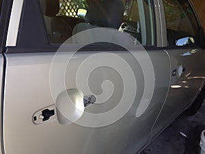 Both door handles are goneâ–ª four door compact car but how to get in it