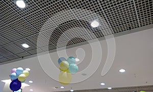 Both Perforated Grid ceiling and White Painted gypsum ceiling joints for an Retail shop during festival sale