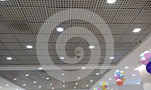 Both Perforated Grid ceiling and White Painted gypsum ceiling joints for an Retail shop during festival sale